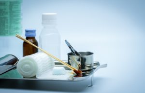 table with various wound care preparation items